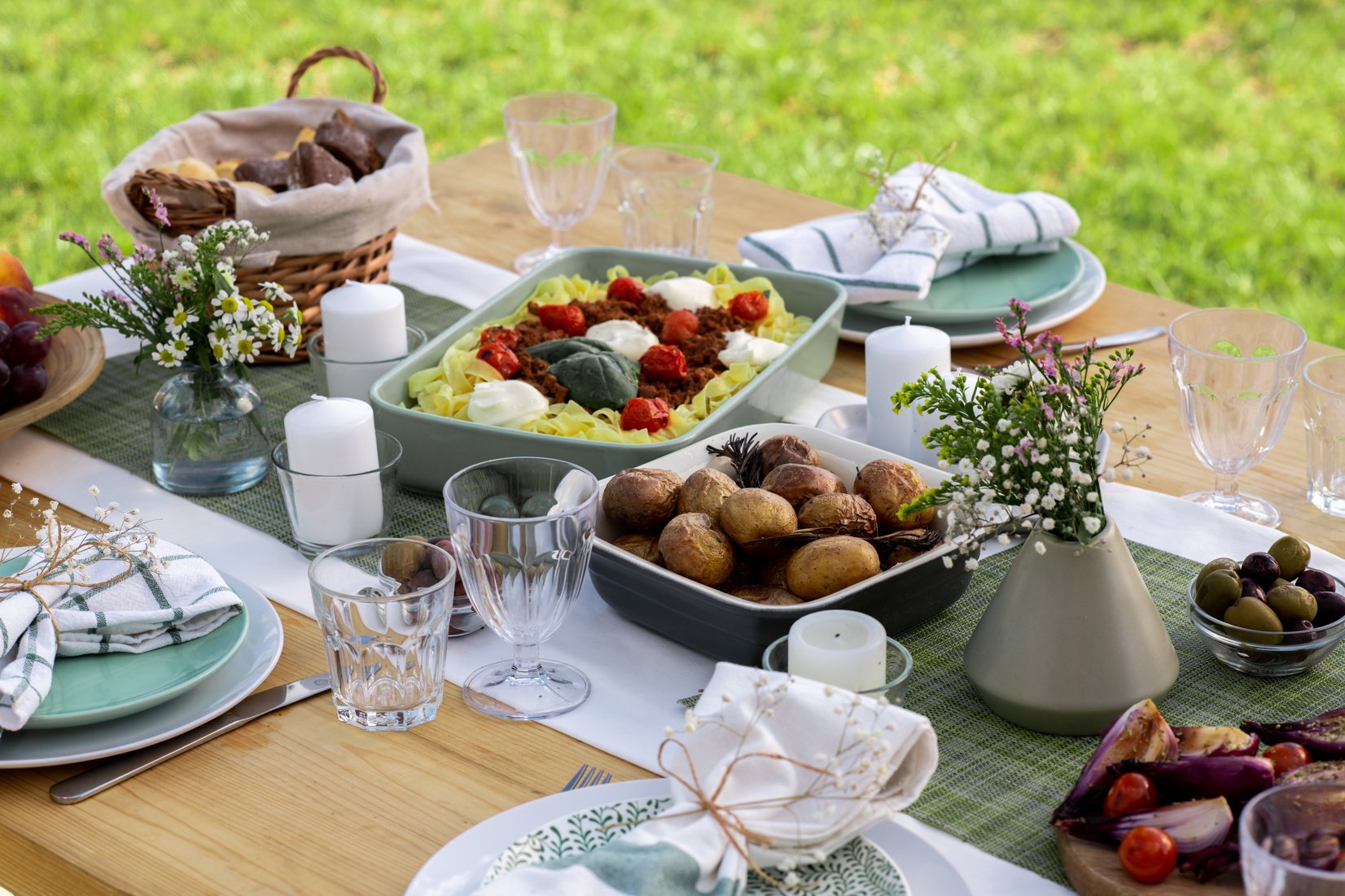 Served table with variety of homemade food prepared for lunch